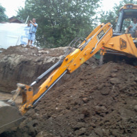 Buldoexcavator excavari excavator pe roti, pneuri- Fundatii Bucuresti si Ilfov